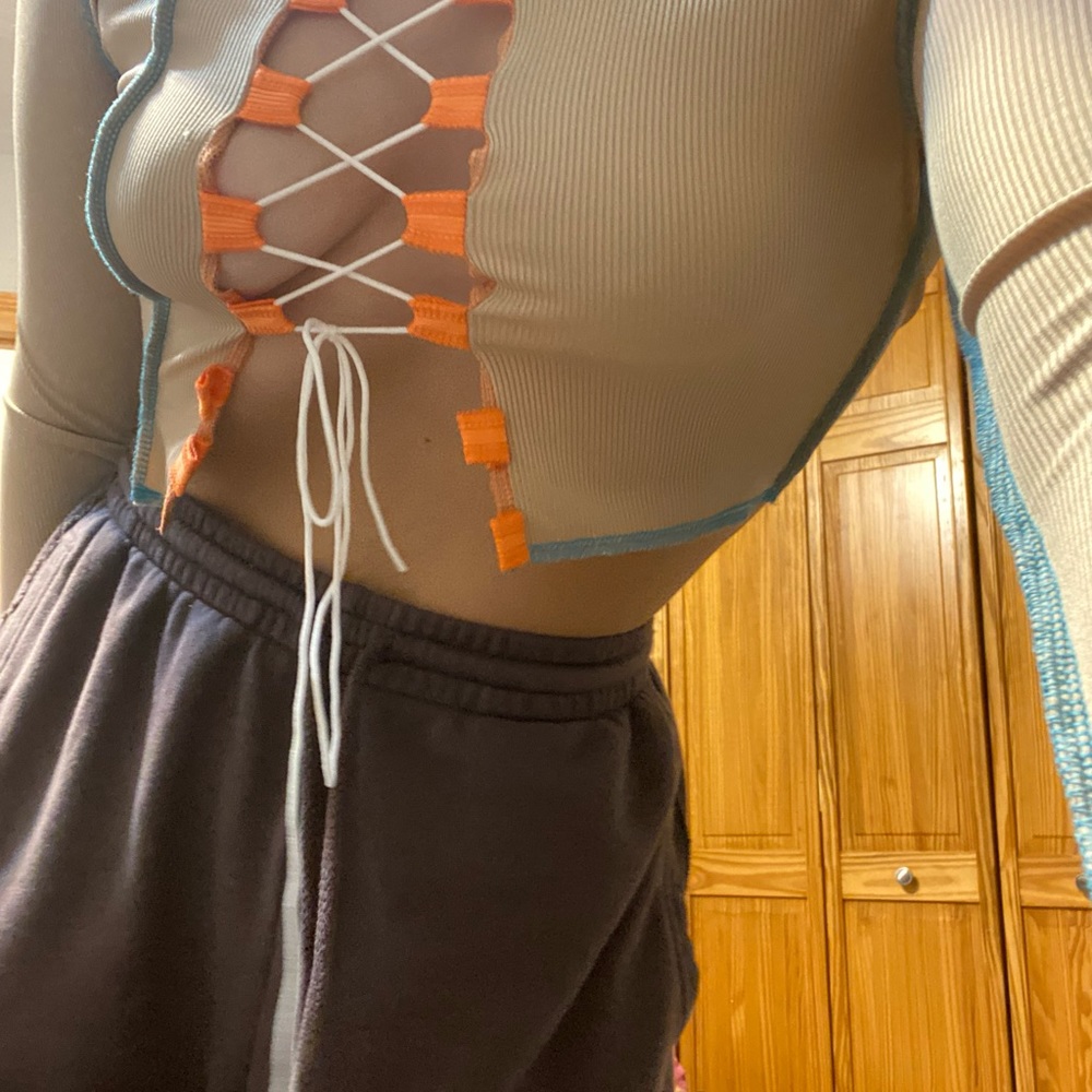 Open front crop top. Brand new, never worn. Very versatile.